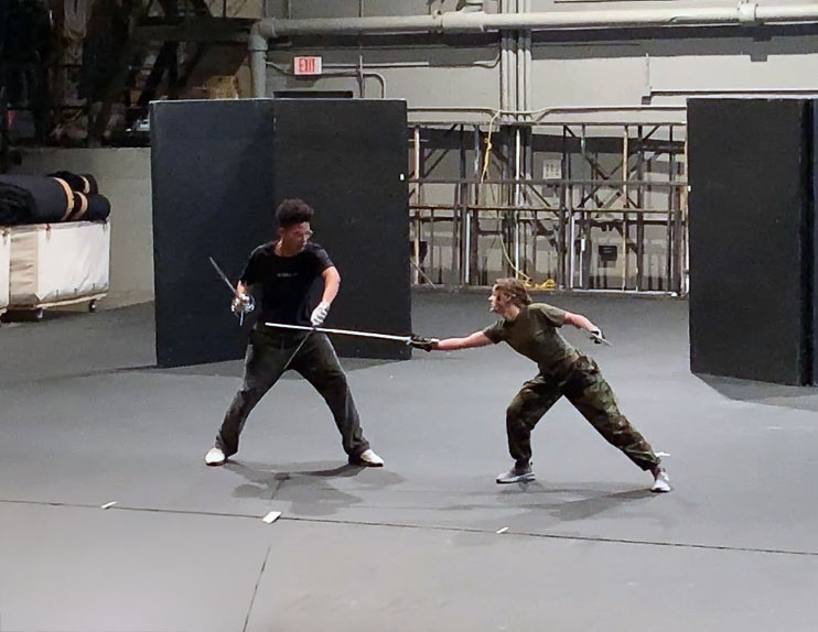 Grey Davis in a sword fight